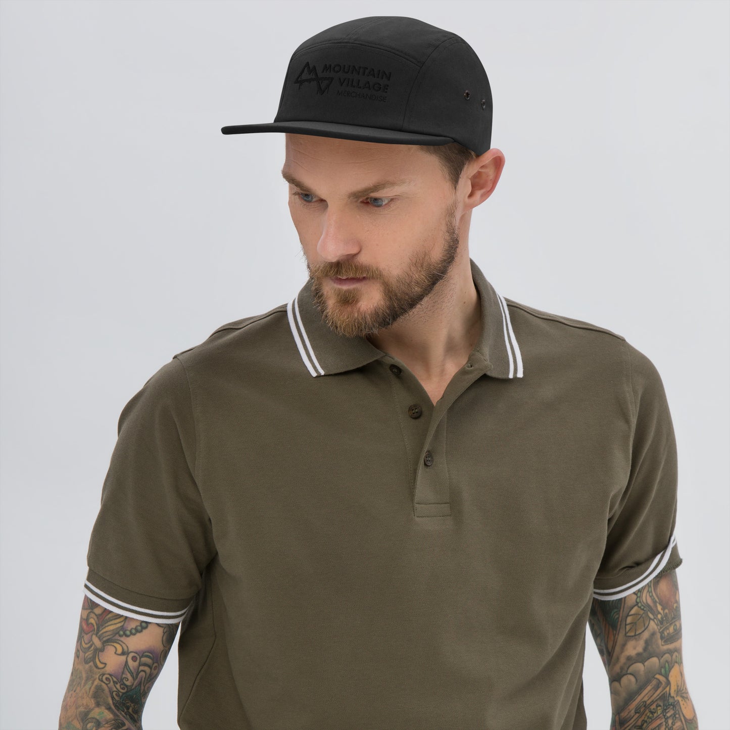 Man modelling camper style five panel hat in colour black