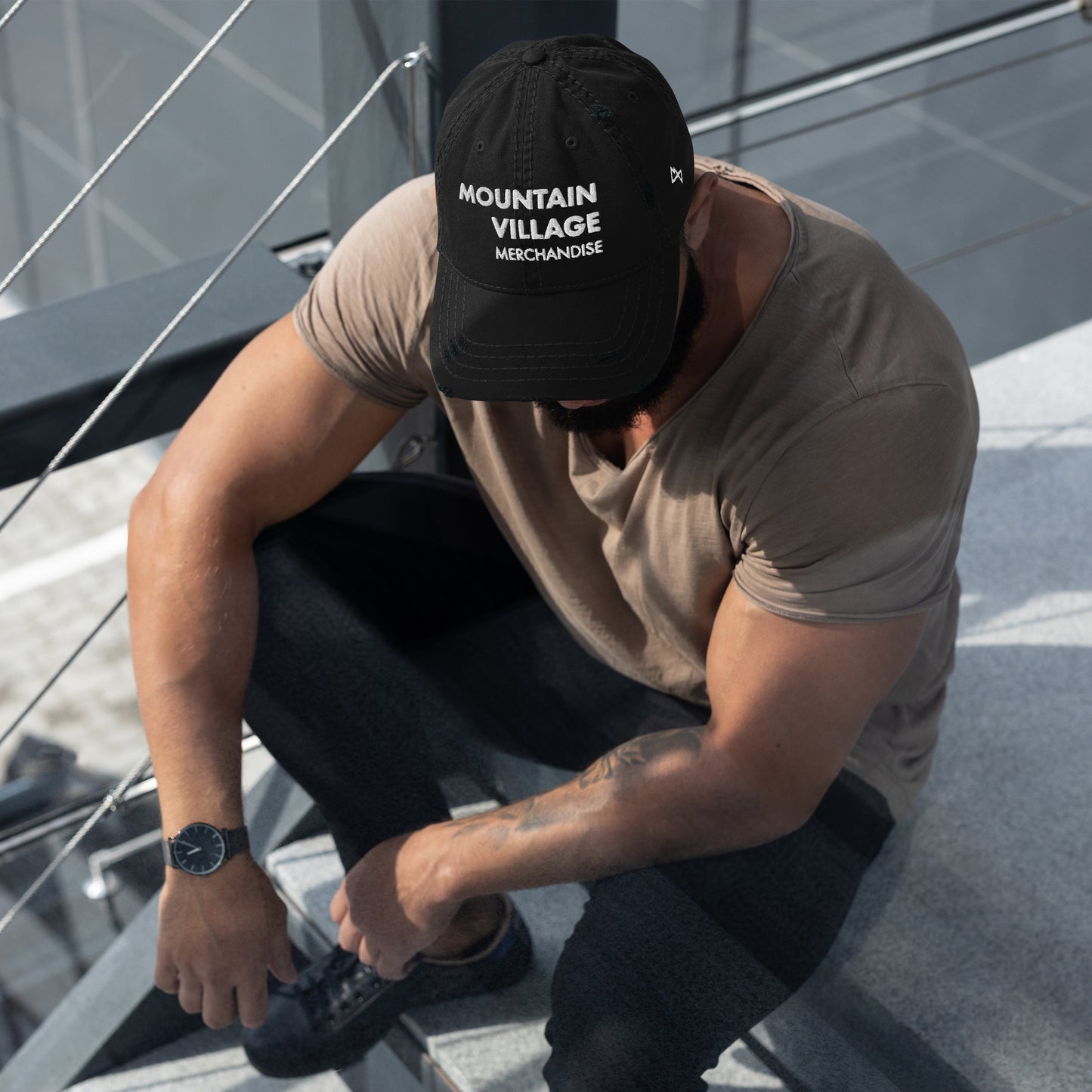 Man sitting and modelling black coloured dad hat