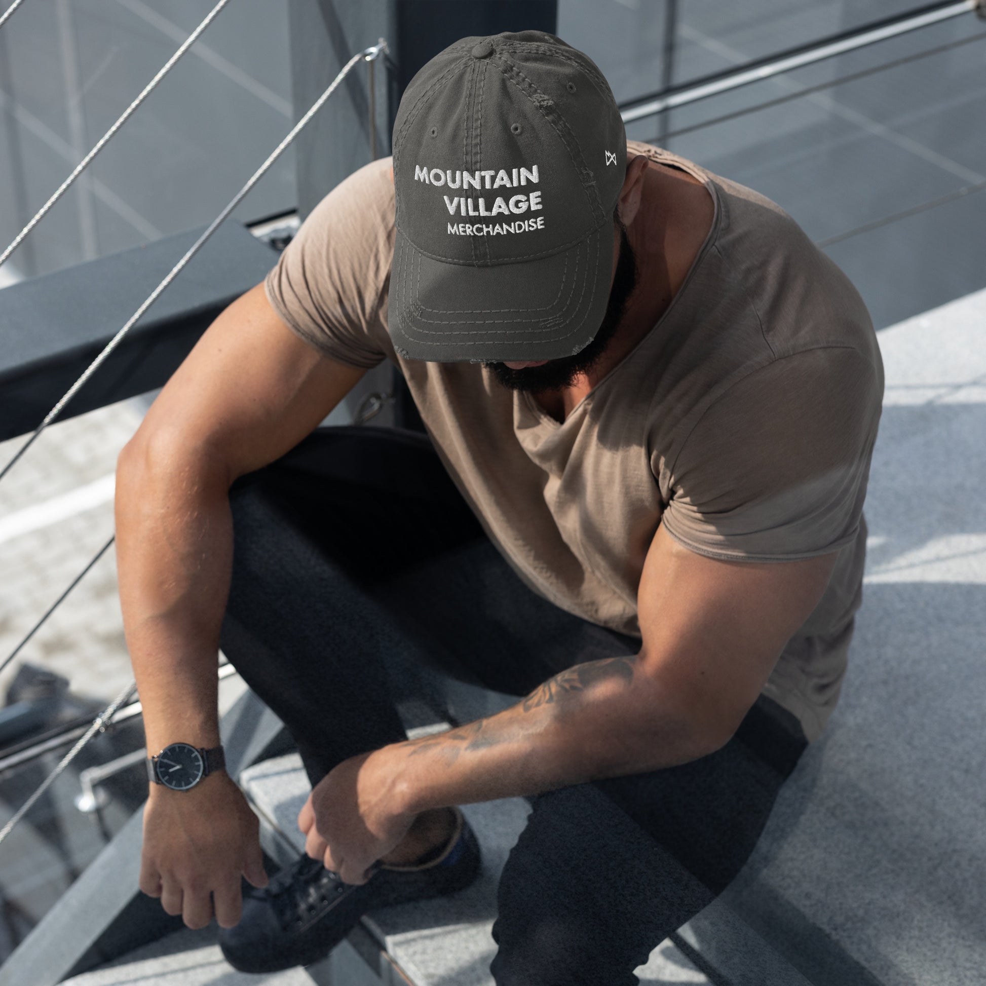 Man sitting and modelling charcoal grey coloured dad hat