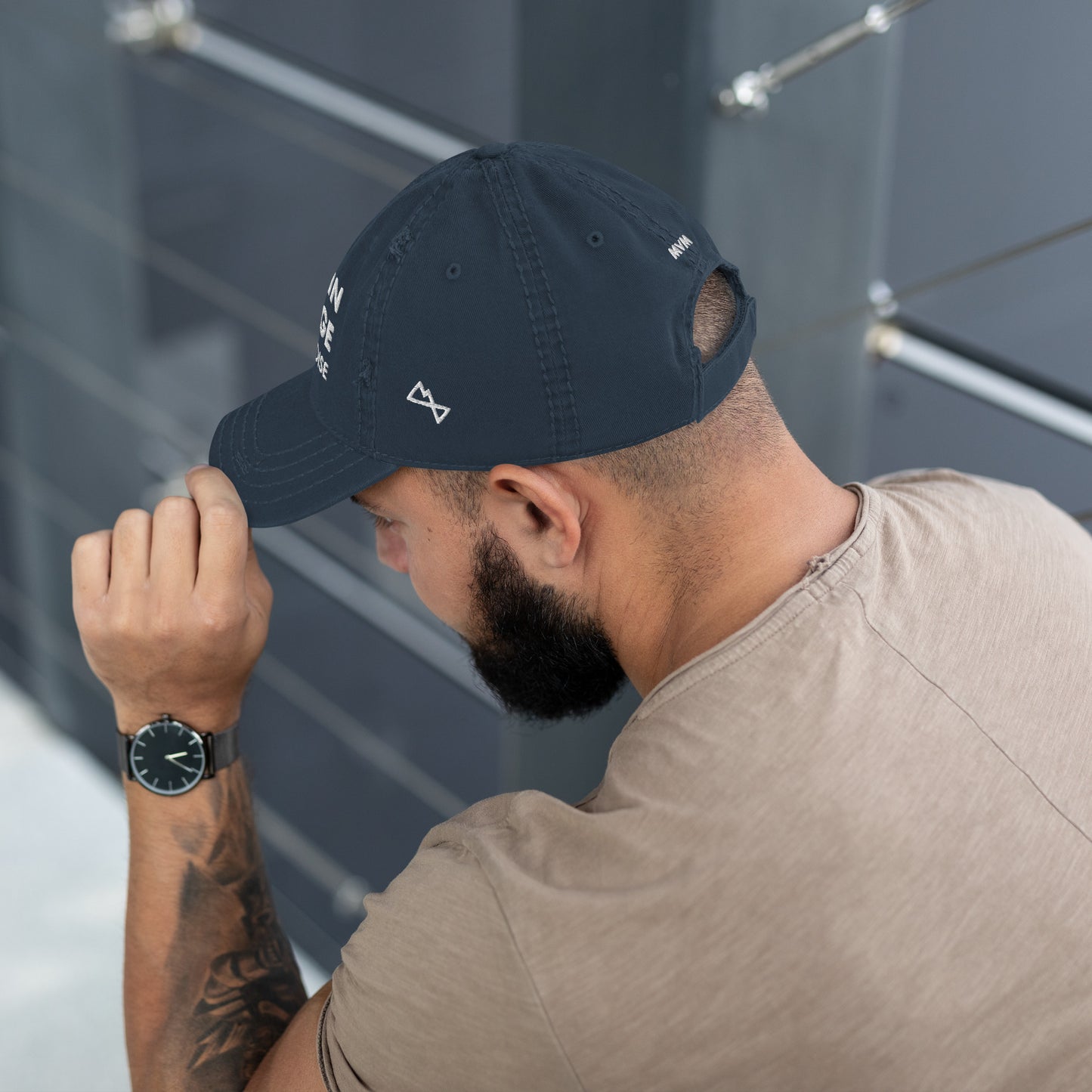 Man modelling navy coloured dad hat